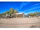 Rustic farm building with tractor and trailer at 8050 S Bianco Rd, Casa Grande, AZ 85193