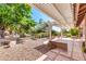 Relaxing backyard patio with pergola and desert landscaping at 8637 E Golden Cholla Cir, Gold Canyon, AZ 85118