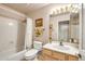 Clean bathroom with a shower/tub combo and updated vanity at 8637 E Golden Cholla Cir, Gold Canyon, AZ 85118