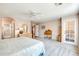 Main bedroom with king-size bed and access to bathroom at 8637 E Golden Cholla Cir, Gold Canyon, AZ 85118