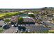 Community clubhouse with pool, tennis courts, and parking at 8637 E Golden Cholla Cir, Gold Canyon, AZ 85118