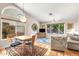 Bright dining room with a large window and seating for four at 8637 E Golden Cholla Cir, Gold Canyon, AZ 85118