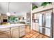 Kitchen features stainless steel appliances and light wood cabinets at 8637 E Golden Cholla Cir, Gold Canyon, AZ 85118