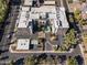 Aerial view of a modern apartment building with parking and landscaping at 914 E Osborn Rd # 208, Phoenix, AZ 85014