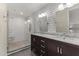 Elegant bathroom with double vanity, marble countertop, and subway tile at 914 E Osborn Rd # 208, Phoenix, AZ 85014