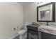 Modern bathroom with a floating vanity and marble countertop at 914 E Osborn Rd # 208, Phoenix, AZ 85014