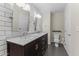 Clean bathroom with double vanity, marble countertop, and subway tile at 914 E Osborn Rd # 208, Phoenix, AZ 85014