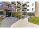 Building entrance with seating area and landscaping at 914 E Osborn Rd # 208, Phoenix, AZ 85014