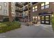Brick building exterior with lush landscaping and a courtyard at 914 E Osborn Rd # 208, Phoenix, AZ 85014