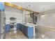 Modern kitchen with blue cabinetry, stainless steel appliances, and a quartz island at 914 E Osborn Rd # 208, Phoenix, AZ 85014