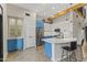 Modern kitchen with blue cabinets, stainless steel appliances, and an island at 914 E Osborn Rd # 208, Phoenix, AZ 85014