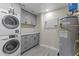 Convenient laundry room with washer, dryer, and storage cabinets at 914 E Osborn Rd # 208, Phoenix, AZ 85014