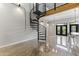 Open living area featuring a spiral staircase and polished concrete floors at 914 E Osborn Rd # 208, Phoenix, AZ 85014