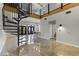 Modern living area with spiral staircase and access to balcony at 914 E Osborn Rd # 208, Phoenix, AZ 85014