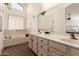 Bathroom boasts double sinks and relaxing bathtub at 9428 W Taro Ln, Peoria, AZ 85382