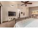 Spacious bedroom with large TV and walk-in closet at 9428 W Taro Ln, Peoria, AZ 85382