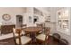 Charming dining area with wood table and chairs, near kitchen at 9428 W Taro Ln, Peoria, AZ 85382