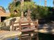 Wooden footbridge over a serene pond at 9428 W Taro Ln, Peoria, AZ 85382