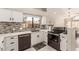 Kitchen with stainless steel appliances and white cabinets at 9428 W Taro Ln, Peoria, AZ 85382