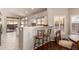 Bright kitchen features a breakfast bar and access to the backyard at 9428 W Taro Ln, Peoria, AZ 85382