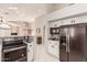 Kitchen with stainless steel appliances and white cabinets at 9428 W Taro Ln, Peoria, AZ 85382