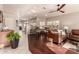 Open living room showcasing hardwood floors and a view of the kitchen at 9428 W Taro Ln, Peoria, AZ 85382