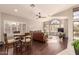 Sunlit living room with hardwood floors and comfortable seating at 9428 W Taro Ln, Peoria, AZ 85382