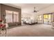 Large main bedroom with plush carpeting and access to the patio at 9428 W Taro Ln, Peoria, AZ 85382