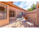 Cozy patio with table, chairs, and brick pavement at 9428 W Taro Ln, Peoria, AZ 85382