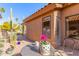 Small patio with table and chairs, featuring desert plants at 9428 W Taro Ln, Peoria, AZ 85382