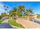 Serene community pond with a wooden bridge and lush landscaping at 9428 W Taro Ln, Peoria, AZ 85382