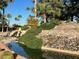 Landscaped water feature with a stone waterfall at 9428 W Taro Ln, Peoria, AZ 85382
