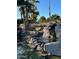 Serene waterfall cascading into a pond at 9428 W Taro Ln, Peoria, AZ 85382