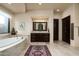 Luxurious bathroom with soaking tub and double vanity at 10585 E Crescent Moon Dr # 19, Scottsdale, AZ 85262