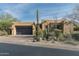 Modern Southwestern home with dark garage door and drought-tolerant landscaping at 10585 E Crescent Moon Dr # 19, Scottsdale, AZ 85262