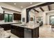 Open kitchen with island, stainless steel appliances, and views to dining area at 10585 E Crescent Moon Dr # 19, Scottsdale, AZ 85262