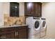 Laundry room with washer, dryer, and ample counter space at 10585 E Crescent Moon Dr # 19, Scottsdale, AZ 85262