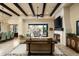 Spacious living room with fireplace, high ceilings, and access to backyard at 10585 E Crescent Moon Dr # 19, Scottsdale, AZ 85262