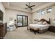 Relaxing main bedroom with sliding glass doors opening to a private patio at 10585 E Crescent Moon Dr # 19, Scottsdale, AZ 85262