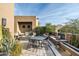 Elegant outdoor patio with seating area and water feature at 10585 E Crescent Moon Dr # 19, Scottsdale, AZ 85262