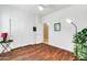 Cozy bedroom features sleek wood-look floors, a ceiling fan and a spacious closet at 10851 E Sonrisa Ave, Mesa, AZ 85212