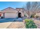 Charming single-story home featuring a well-maintained front yard and a two-car garage at 10851 E Sonrisa Ave, Mesa, AZ 85212