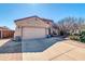 View of the home showcasing the driveway, garage and drought-resistant landscaping at 10851 E Sonrisa Ave, Mesa, AZ 85212