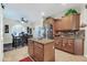 Kitchen featuring a center island, stainless steel appliances, breakfast nook, and wood cabinets at 10851 E Sonrisa Ave, Mesa, AZ 85212