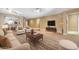 Comfortable living room featuring plush seating, stylish decor, and an open layout to the kitchen bar at 10851 E Sonrisa Ave, Mesa, AZ 85212