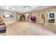 Bright open-plan living area featuring neutral walls, tile flooring, and modern lighting at 10851 E Sonrisa Ave, Mesa, AZ 85212