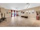 Spacious living room featuring tile flooring and sliding glass doors at 10851 E Sonrisa Ave, Mesa, AZ 85212
