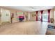 Spacious living room featuring tiled flooring and sliding glass doors leading to the pool area at 10851 E Sonrisa Ave, Mesa, AZ 85212