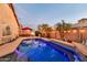 Swimming pool with underwater lights and a patio area, perfect for evening swims and outdoor relaxation at 10851 E Sonrisa Ave, Mesa, AZ 85212