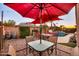 Backyard patio area featuring outdoor dining and pool area at 10851 E Sonrisa Ave, Mesa, AZ 85212